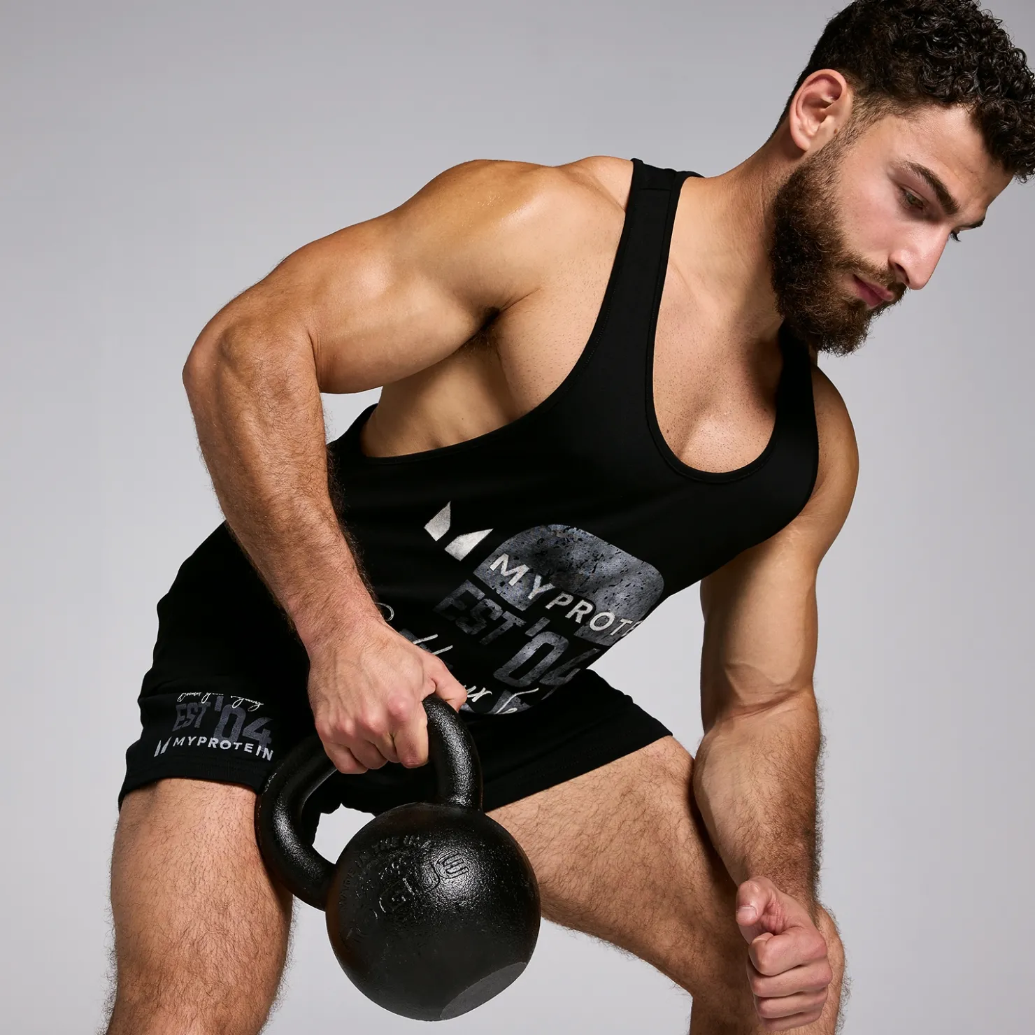 MYPROTEIN MP Herren Origin Stringer-Top mit Grafik Verwaschenes Schwarz*Herren Tanktops | T-Shirts & Tops