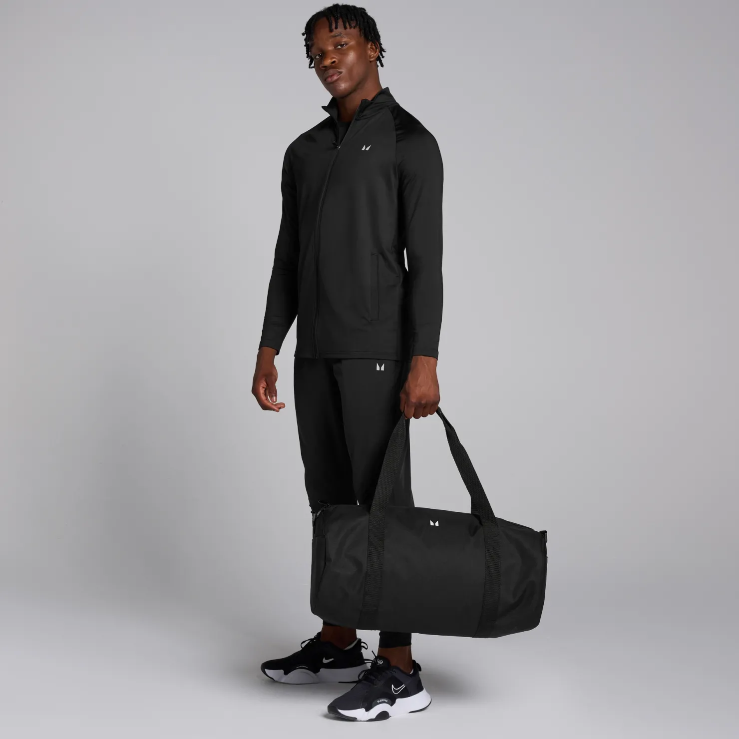 MYPROTEIN MP Herren Trainingsoberteil mit durchgehendem Reißverschluss – Schwarz*Herren Jacken & Westen